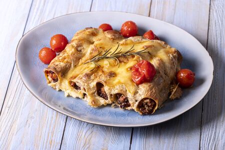 six italian canneloni pasta rolls on wood の写真素材