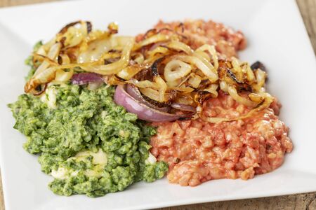 beetroot and spinach spaetzle on a plate の写真素材