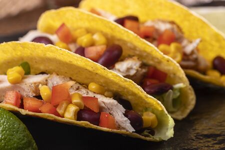 three mexican tacos on slate の写真素材