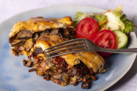 steak in puff pastry on a plateの写真素材