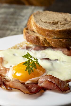 egg sunny side up on a plateの写真素材