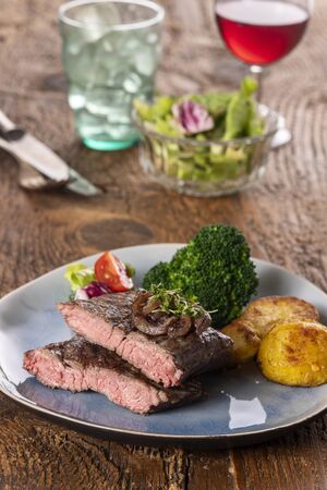 halves of a steak on a plateの写真素材