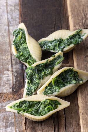 italian conchiglino pasta filled with spinachの写真素材