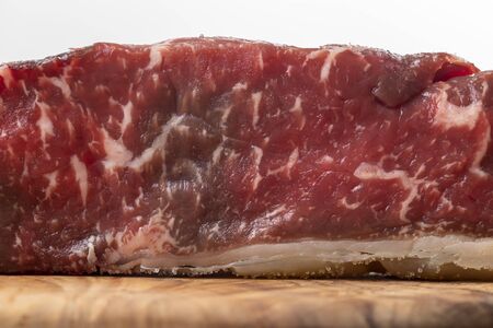 raw steak on olive wood の写真素材
