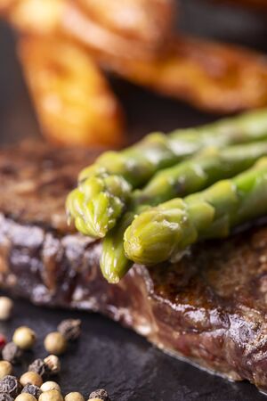 green asparagus on a steakの写真素材