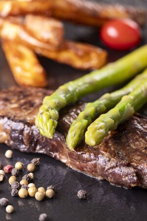 green asparagus on a steakの写真素材
