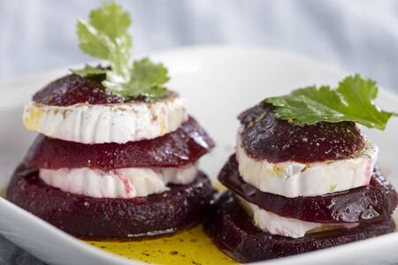 beetroot slices with goat cheese and oilの写真素材
