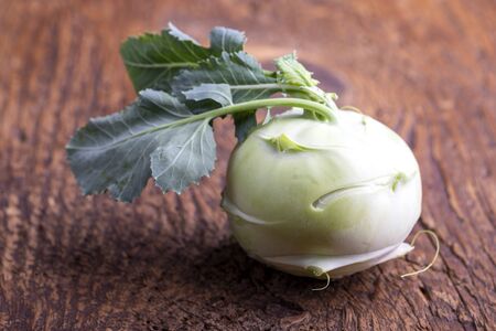 single raw cabbage turnip on woodの写真素材