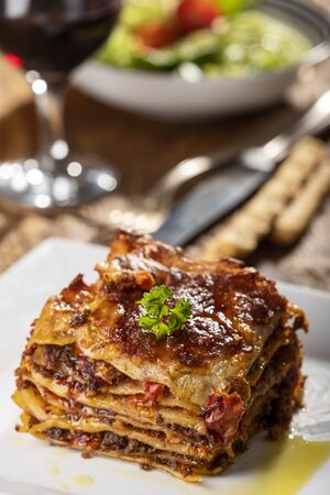 portion of lasagna on a plateの写真素材