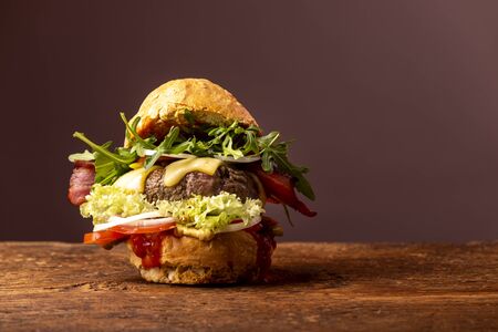 single hamburger on dark woodの写真素材