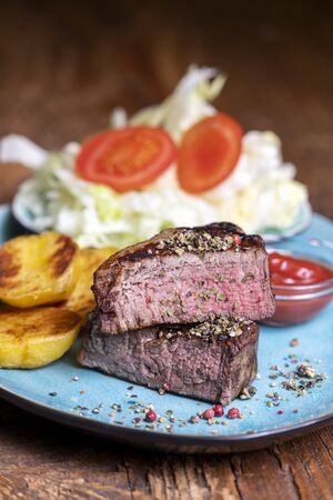 grilled steak on a plateの写真素材