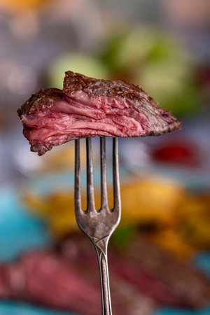 slice of steak on a forkの写真素材