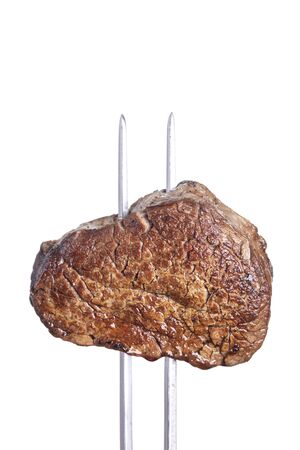 grilled steak on a meat forkの写真素材