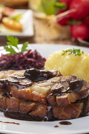 bavarian roasted pork with dumplings and cabbageの写真素材