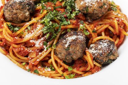 spaghetti with meat balls on dark woodの写真素材