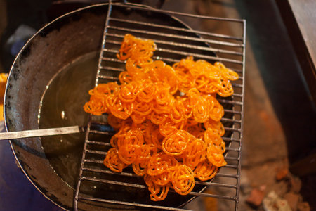 indian jalebi sweet dessert on a grillage
