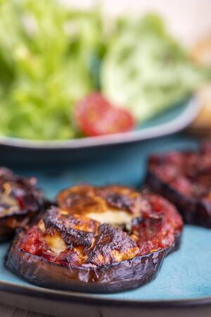 grilled eggplants with cheese and saladの写真素材