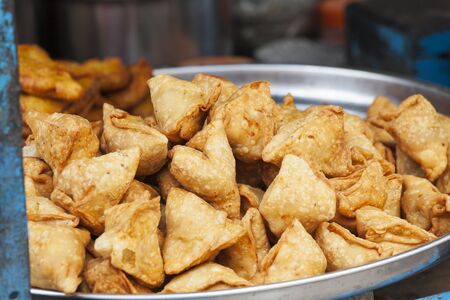 lots of indian samosa on a plateの写真素材