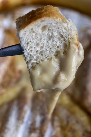 swiss cheese fondue with breadの写真素材
