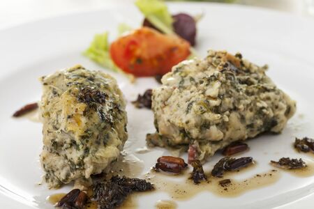 italian strangolapreti dumplings on a plateの写真素材