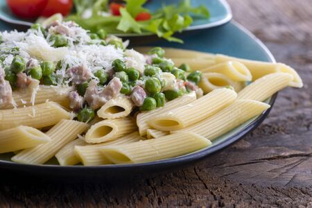 rigatoni emiliana on dark rustic woodの写真素材