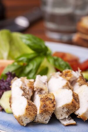 chicken breast slices on fresh saladの写真素材