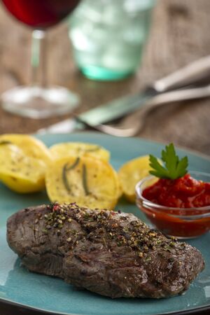 pepper steak with grilled potatoesの写真素材