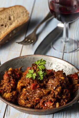 portion of austrian goulash on wood の写真素材