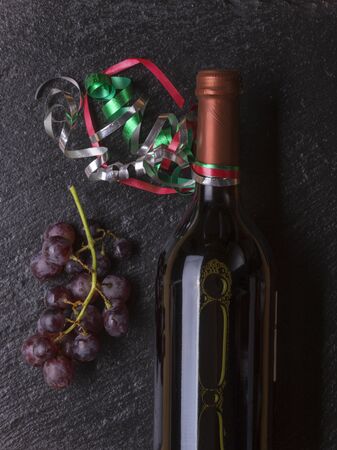 bottle of wine with grapesの写真素材