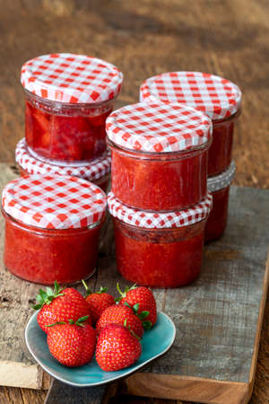 strawberry marmalade on woodの写真素材