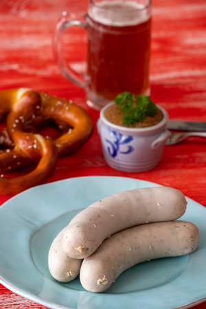 bavarian white sausage on red backgroundの写真素材