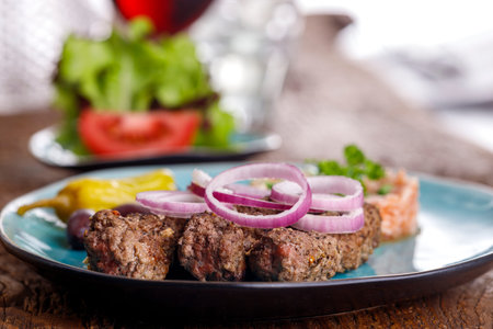 cevapcici with djuvec rice on wood