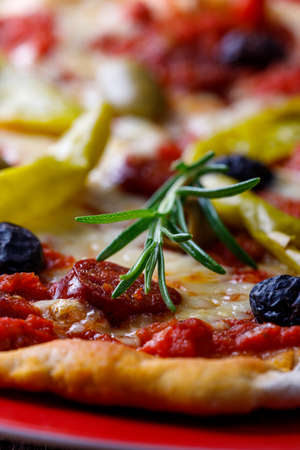 fresh pizza with rosemaryの写真素材