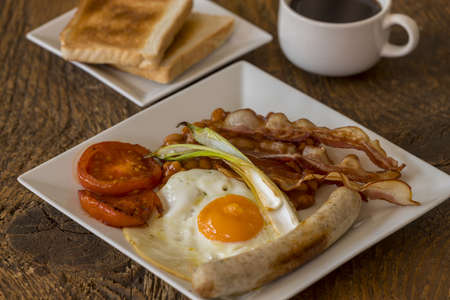 english breakfast on wood with coffeeの写真素材