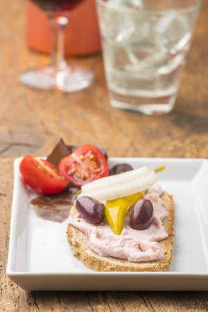 bread with greek taramas spread on woodの写真素材