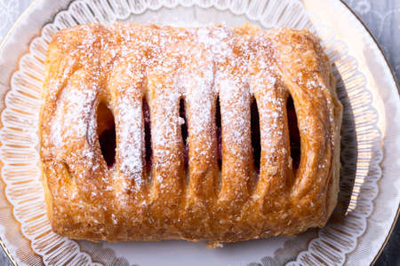 cherry pastry with icing sugarの写真素材