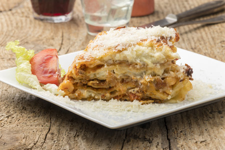 portion of lasagna on a white plateの写真素材