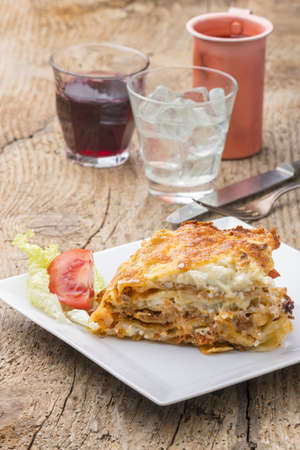 portion of lasagna on a white plateの写真素材