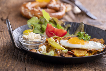 Bavarian potato groestl on woodの写真素材