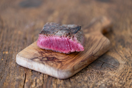 slice of a steak on woodの写真素材