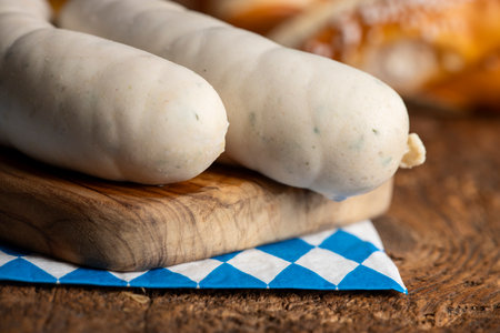 two bavarian white sausages on woodの写真素材