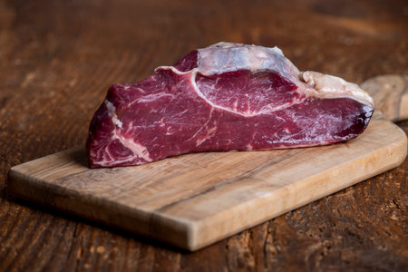 Raw steak on a cutting boardの写真素材