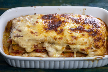 Italian lasagne in a white casseroleの写真素材