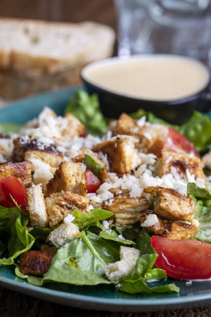 caesar salad on a green plateの写真素材