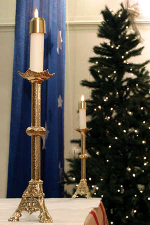 Altar Candle - Close-up on the altar candle during the Christmas season Church decorations.のeditorial素材