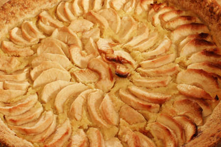 Apple Pie - closeup - Homemade French authentic classic recipe.  The apple slices are laid on top of a custard layer.の写真素材