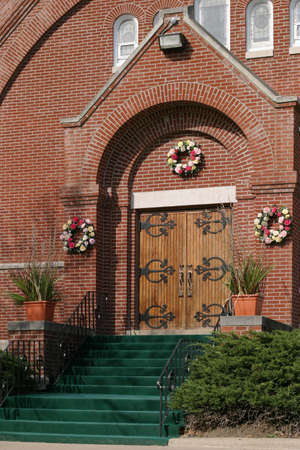 Church Entrance - Easter time facade of a charming small church in the Iowa Heartland, USA.の写真素材