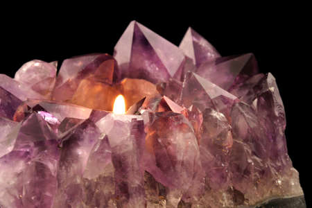 Amethyst Candle Holder - Quartz crystal used in alternative medicine to alleviate stress and anxiety.の写真素材