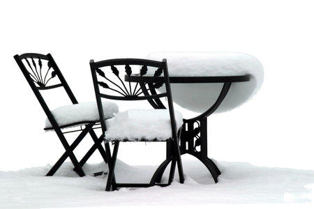 Bistro Set on White - Garden furniture after a snowstormの写真素材