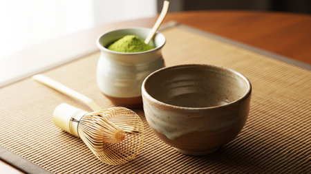 Japanese matcha green tea ceremony with bamboo whisk and bowl on bamboo matの素材